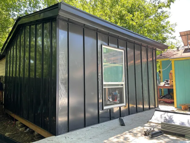 Black standing seam metal wall panels for Roof Inspection in Waukegan